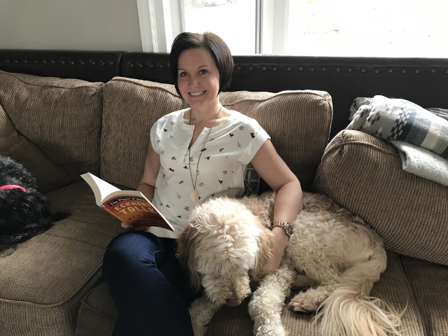 Andrea Parker on couch with dog